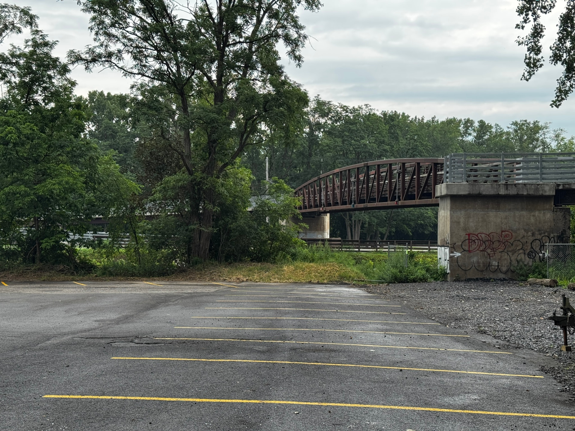 The Erie Canal, trail and pedestrian bridge at the edge of the campus today